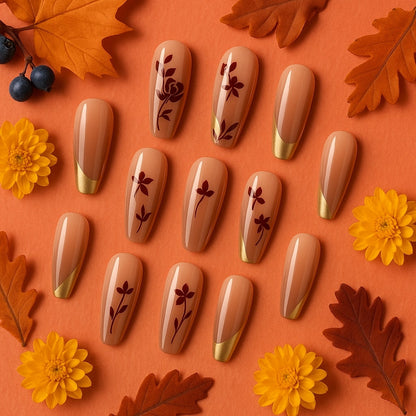 Nude & Gold Press-On Nails – Burgundy Floral Accent Design.